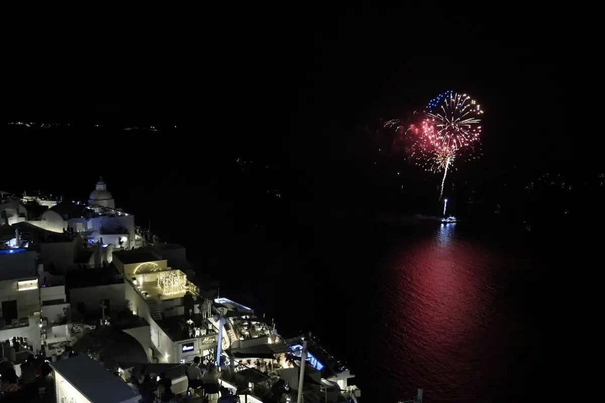 Fireworks seen above the caldera with Santorini terraces in the foreground