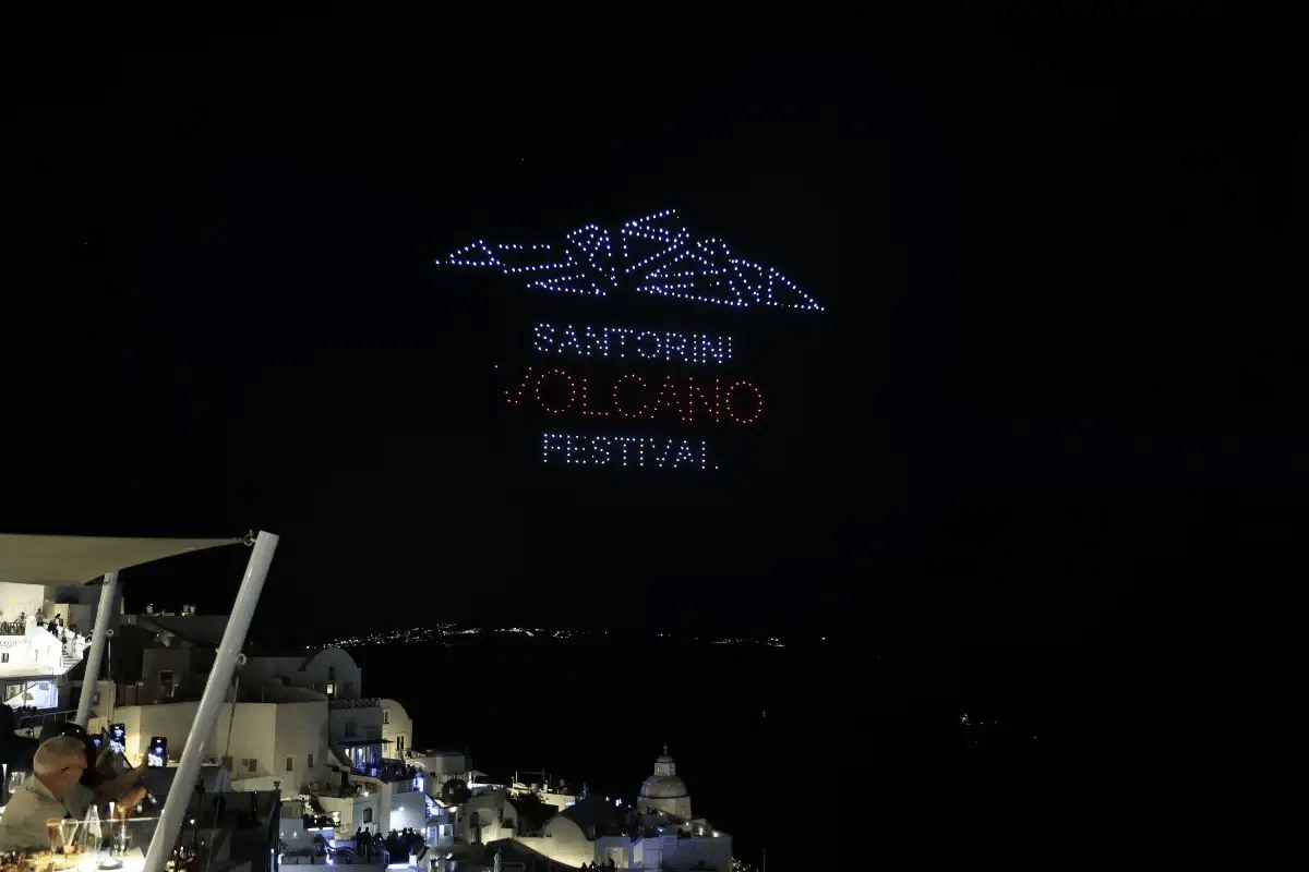 Drones forming Santorini Volcano Festival in the night sky